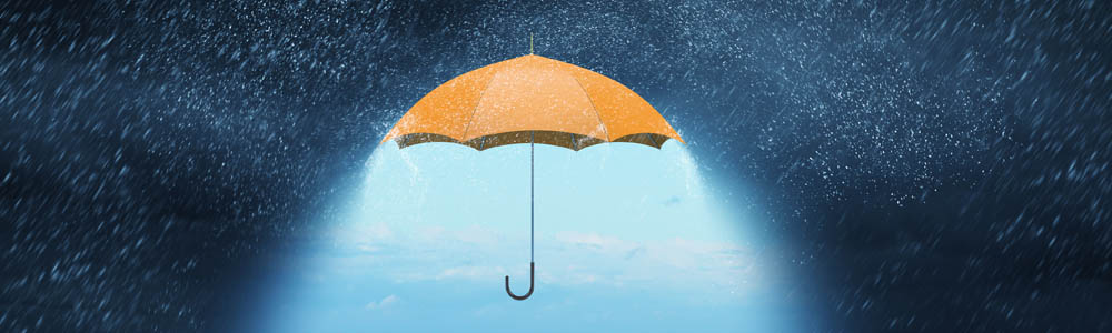 Yellow umbrella in a rain storm, underneath the umbrella is a bright blue sky without rain